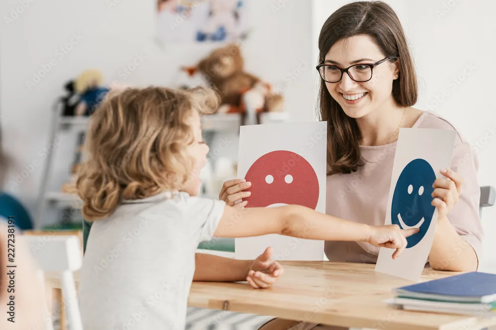 Home 1 Emotion emoticons used by a psychologist during a therapy session with a child with an autism spectrum disorder.